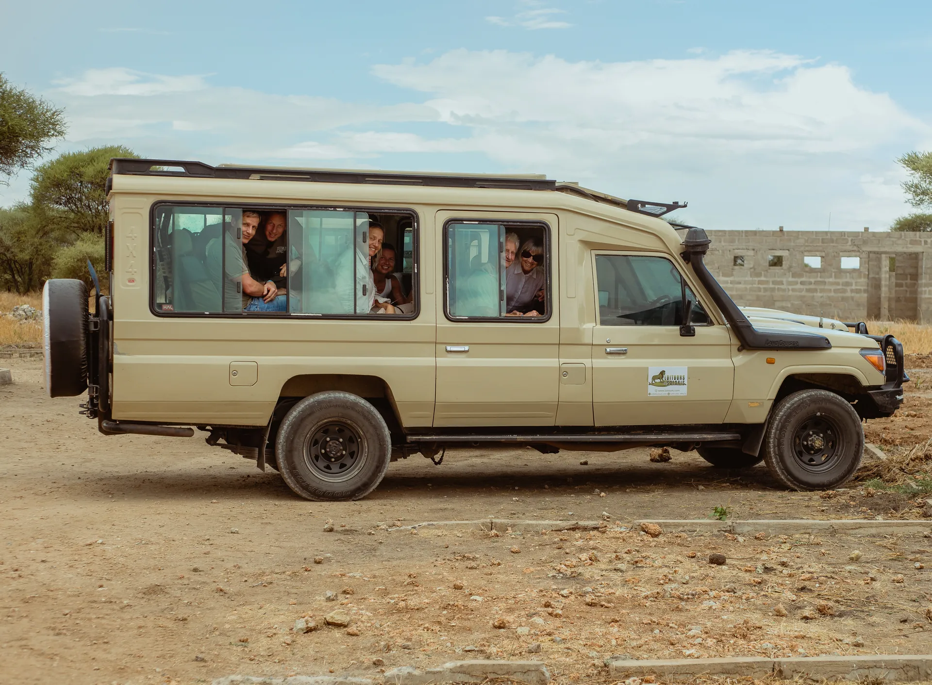 Safari vehicle travelling through a Tanzania wildlife area